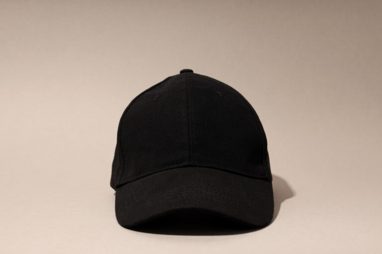 Black stylish cap on a light background